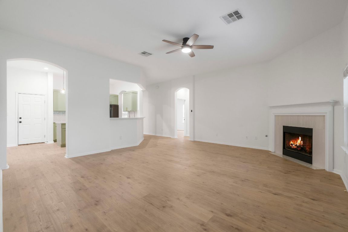 1333 Clary Sage Loop Round Rock, TX 78665 - Photo 7 of 35 a view of an empty room with a fireplace