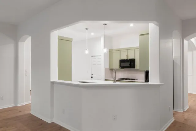 a bathroom with a sink and a large mirror