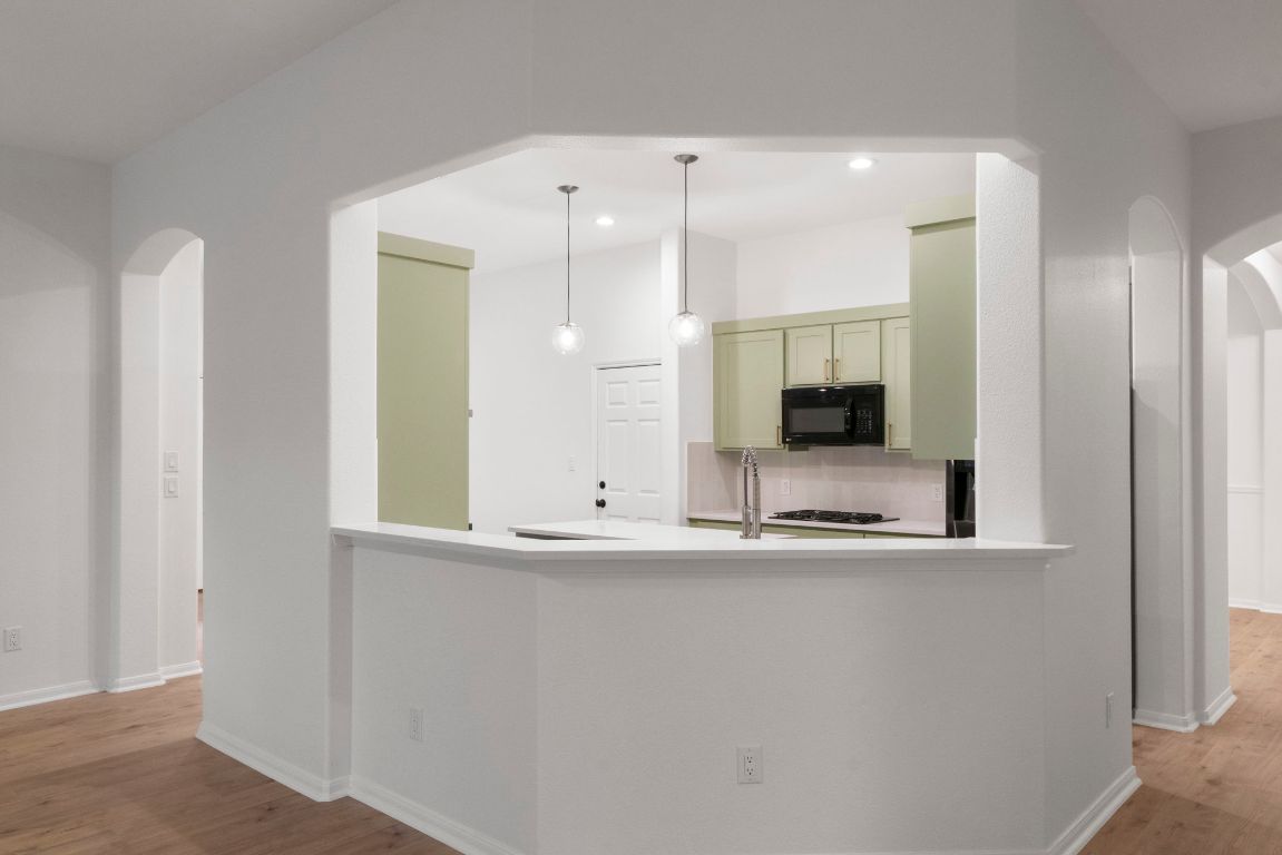 1333 Clary Sage Loop Round Rock, TX 78665 - Photo 8 of 35 a bathroom with a sink and a large mirror