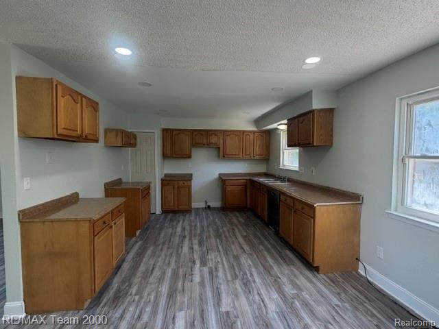 580 Palmerston Street River Rouge, MI 48218 - Photo 5 of 19 Kitchen featuring wood-finish cabinetry, laminate countertops, recessed lighting, and wood-finish flooring