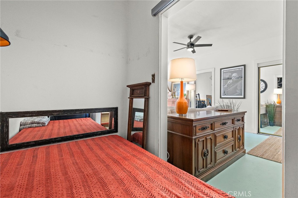 10 Atlantic Way, Unit 704 Long Beach, CA 90802 - Photo 4 of 13 a bedroom with a bed and a dresser