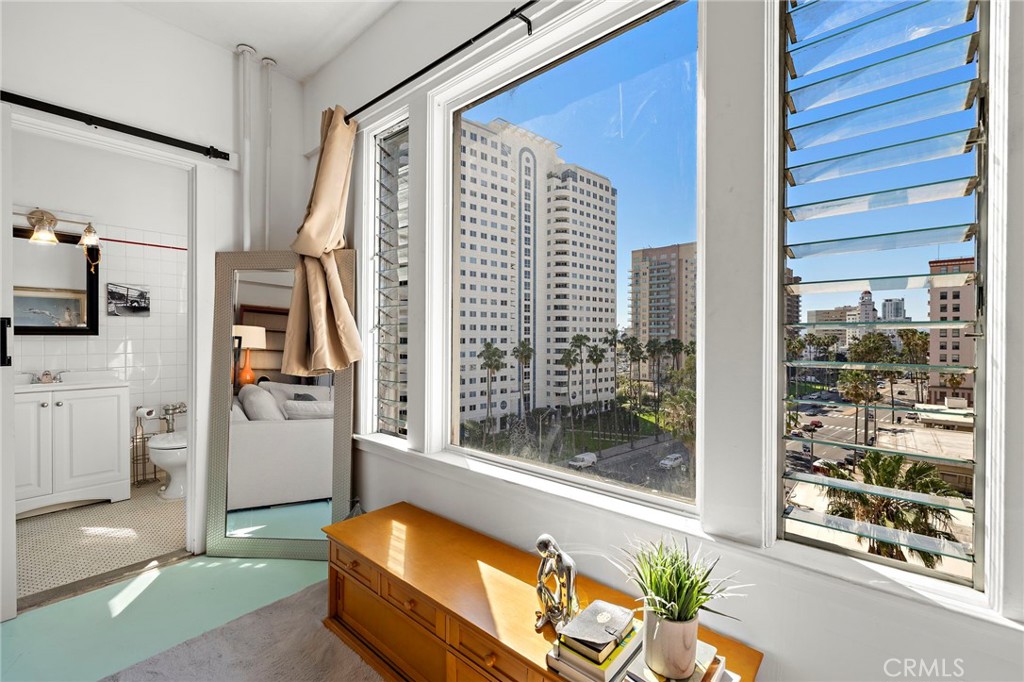 10 Atlantic Way, Unit 704 Long Beach, CA 90802 - Photo 6 of 13 a living room with furniture and a floor to ceiling window