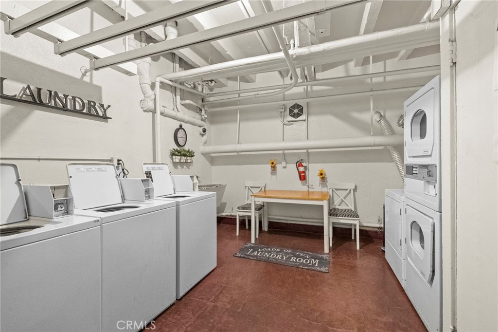 10 Atlantic Way, Unit 704 Long Beach, CA 90802 - Photo 10 of 13 a utility room with cabinets and washer