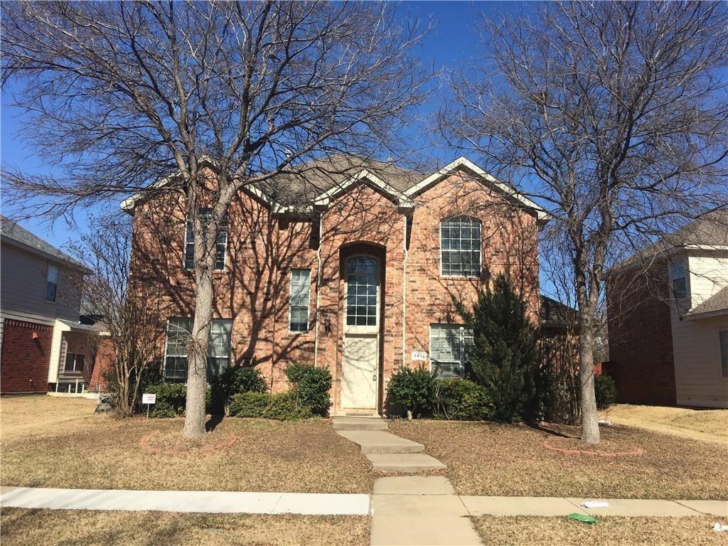 4433 Riptide Lane Plano, TX 75024 - Photo 1 of 12 Two-story brick exterior featuring a prominent arched entryway, multiple windows with grid patterns, and a central walkway