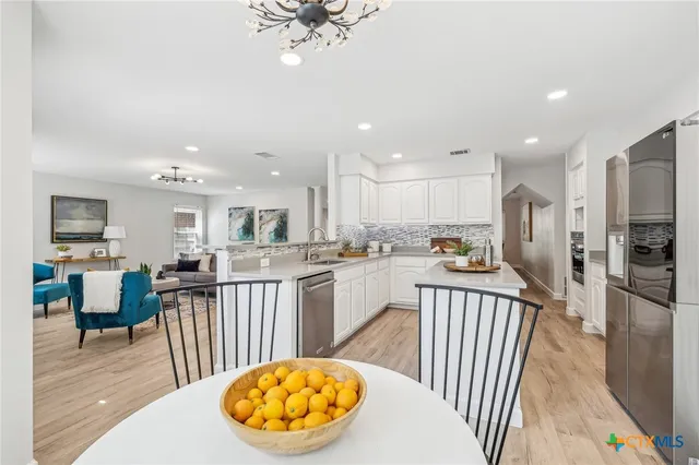 a view of a kitchen and dining room