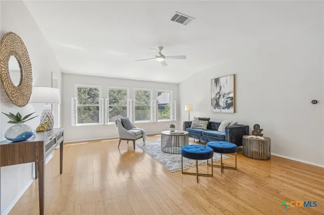 a living room with furniture and a large window