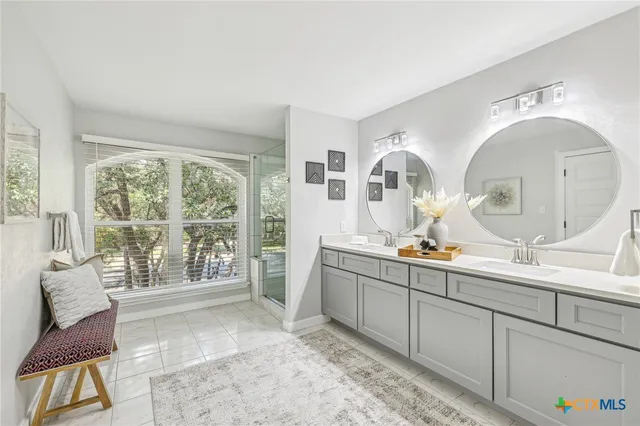 a view of a bedroom with furniture and large windows