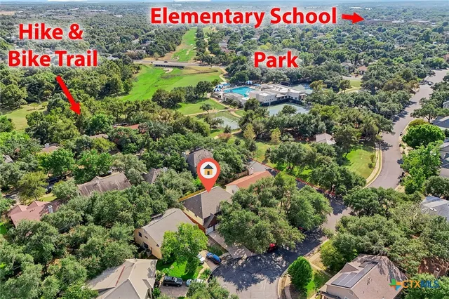 a view of a sign that is in front of flowers