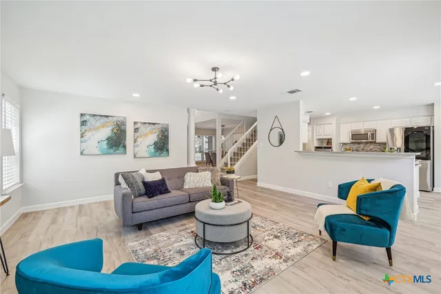 a living room with furniture and a table