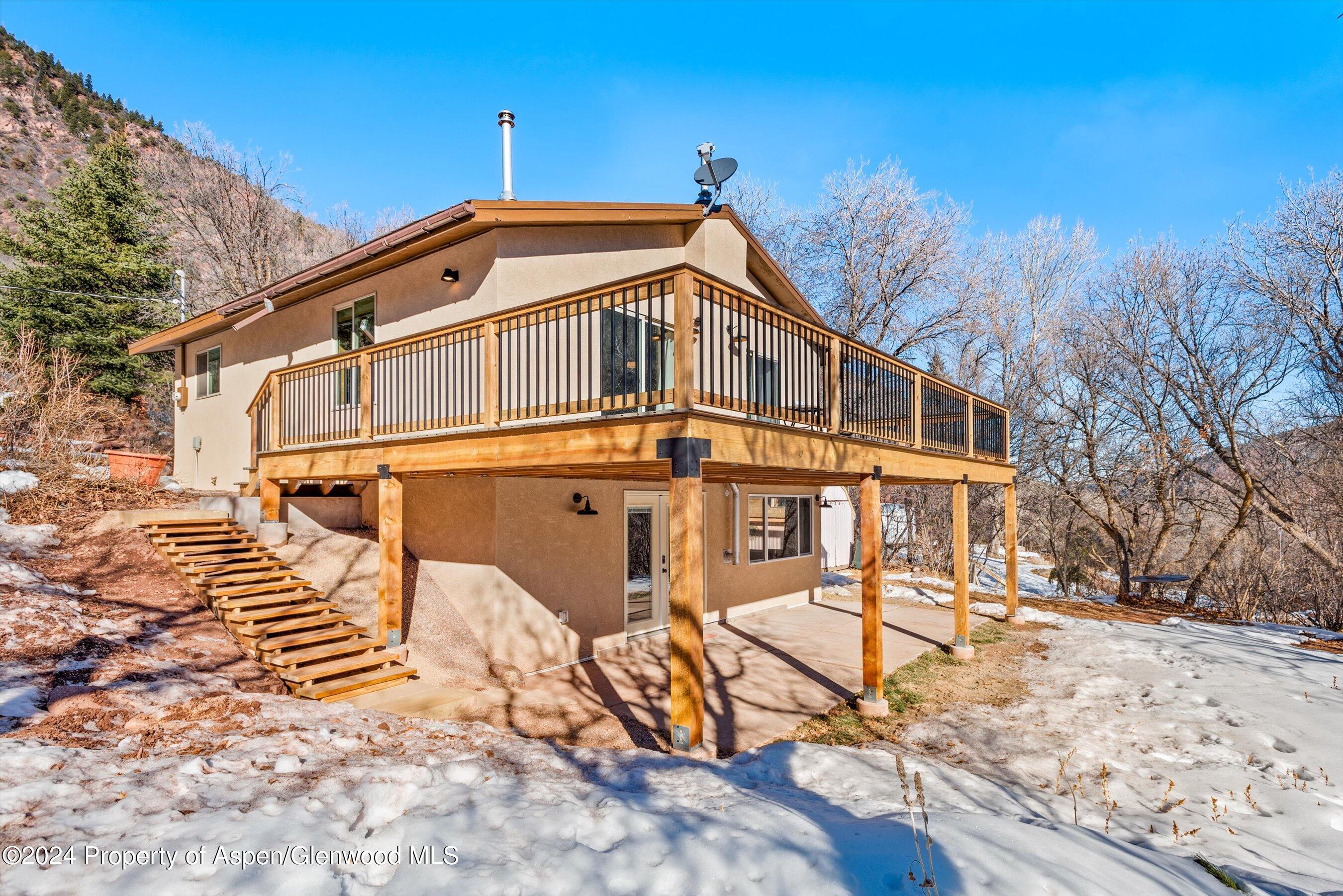 212 Cherokee Lane Carbondale, CO 81623 - Photo 22 of 34 a front view of a house with a yard