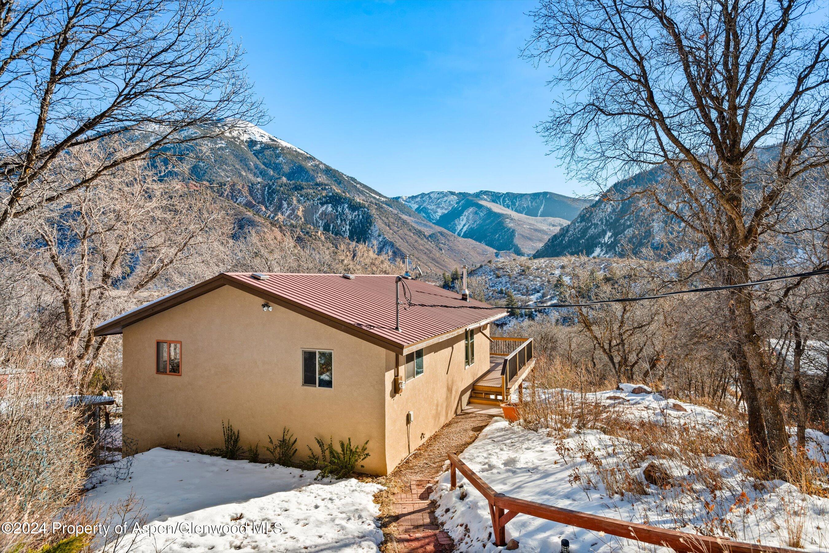 212 Cherokee Lane Carbondale, CO 81623 - Photo 25 of 34 a view of a house with a yard