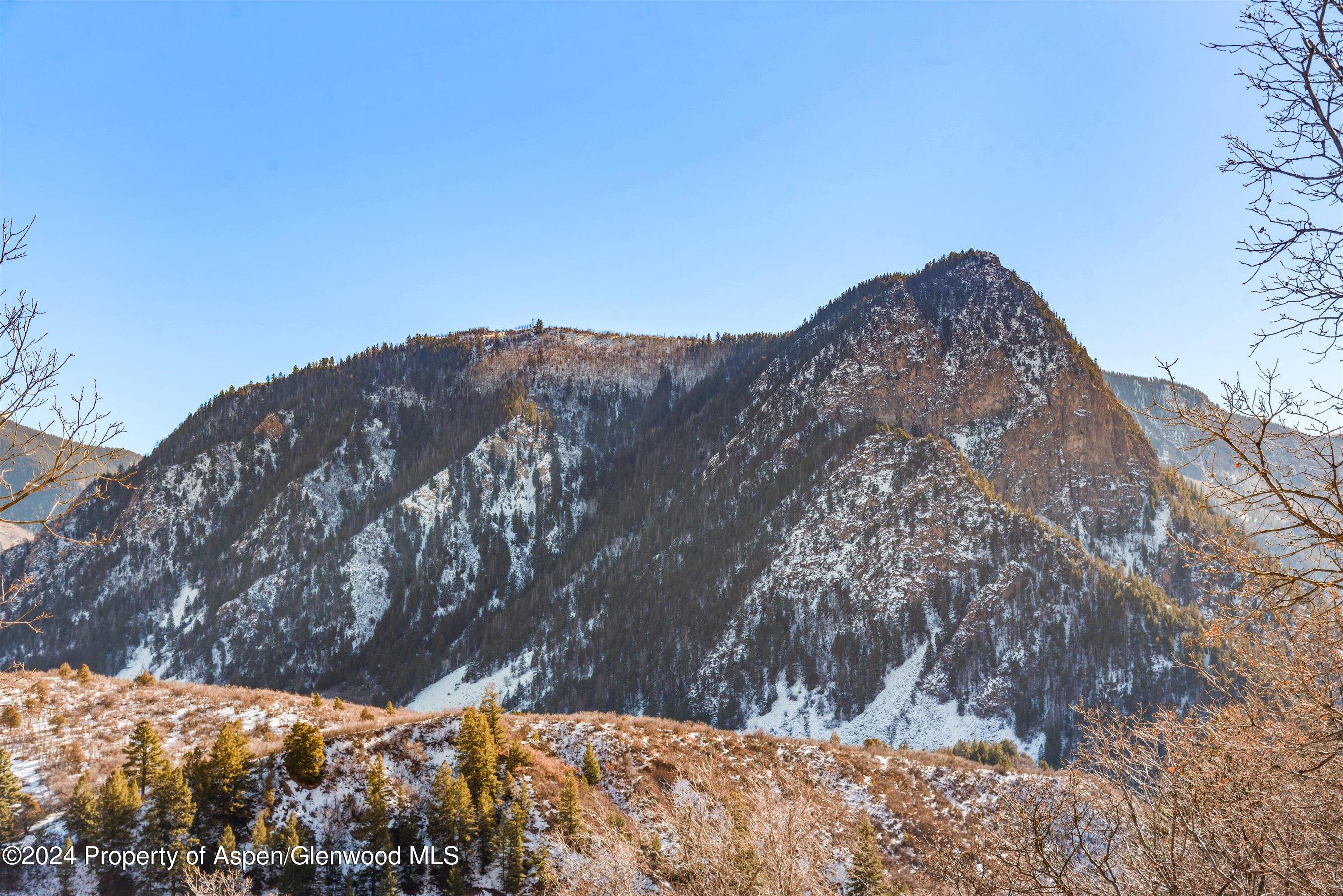 212 Cherokee Lane Carbondale, CO 81623 - Photo 34 of 34 a view of a dry yard with mountains in the background