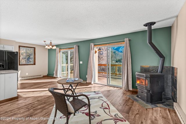 a view of a livingroom with furniture and window