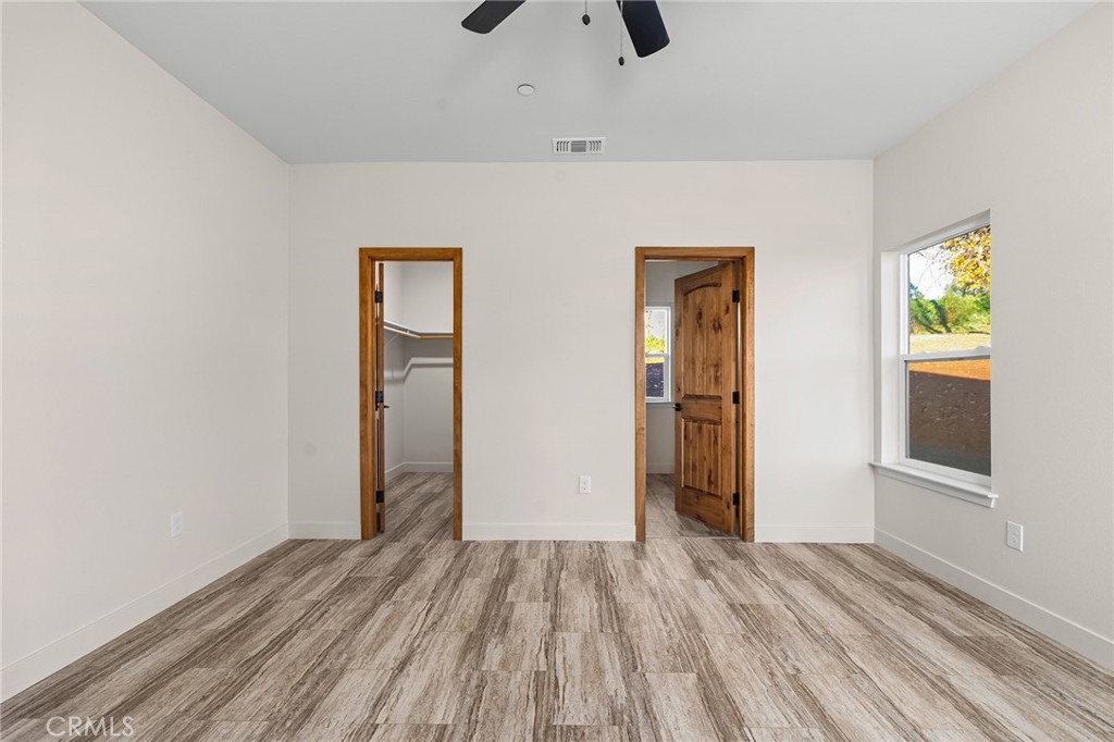 2235 Stearns Road Paradise, CA 95969 - Photo 13 of 42 an empty room with closet and wooden floor