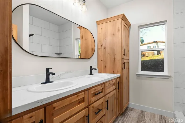 a bathroom with a sink and a mirror