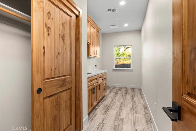 a kitchen with stainless steel appliances granite countertop a sink and a window