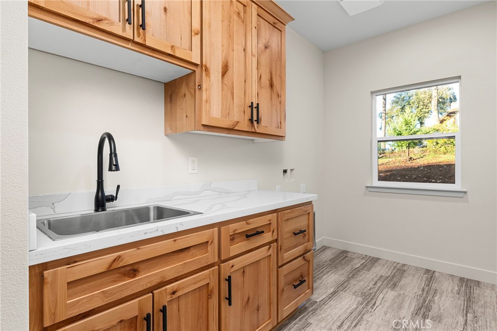 2235 Stearns Road Paradise, CA 95969 - Photo 25 of 42 a kitchen with stainless steel appliances granite countertop a sink and a window