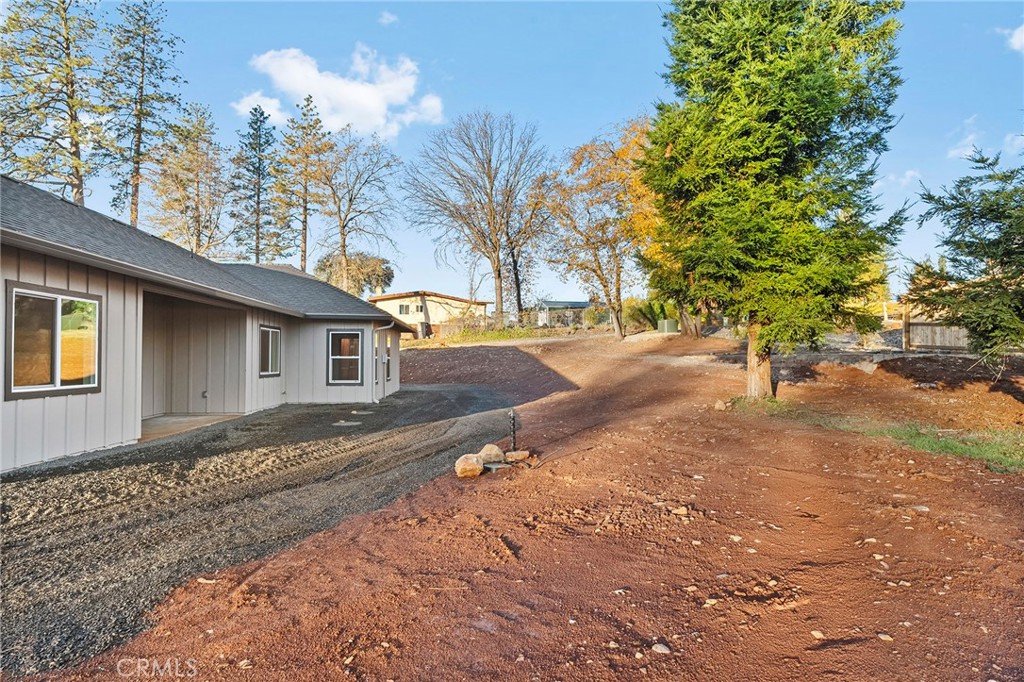 2235 Stearns Road Paradise, CA 95969 - Photo 28 of 42 a front view of a house with a yard and garage