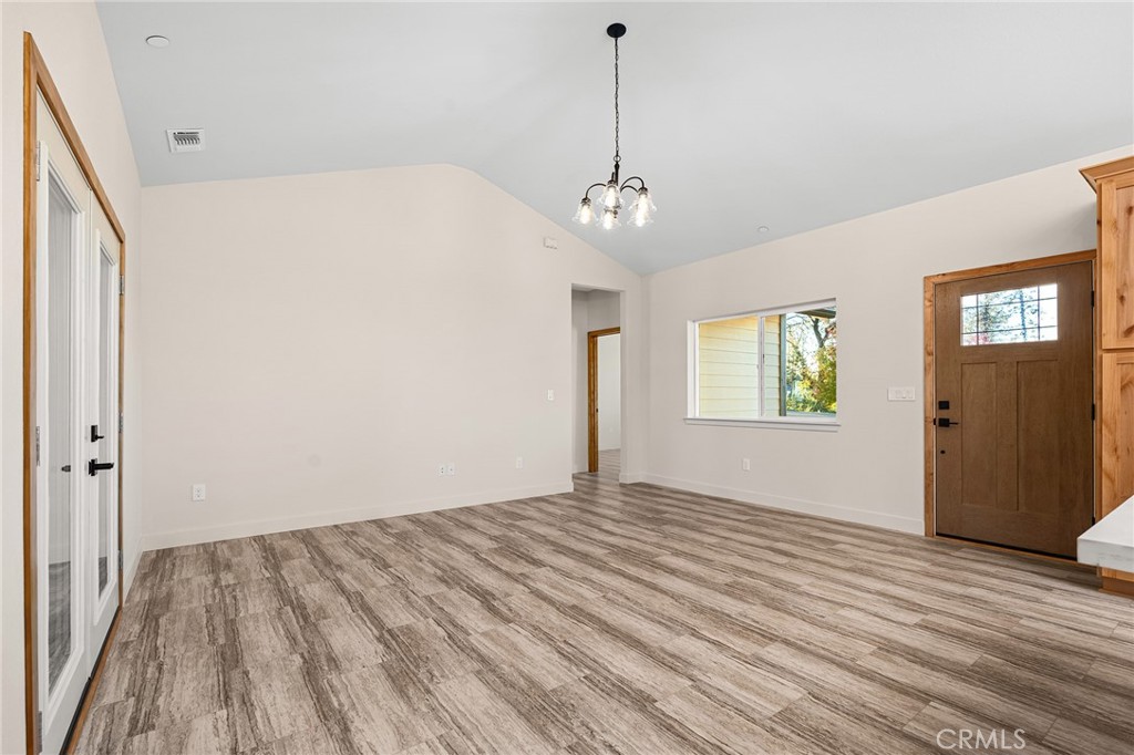2235 Stearns Road Paradise, CA 95969 - Photo 5 of 42 a view of empty room with wooden floor and window