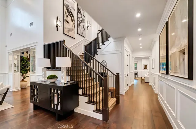 a living room with furniture or couch and a chandelier