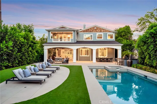 a large kitchen with a table and chairs