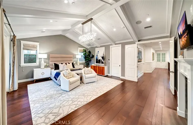 a bedroom with a bed and a fireplace