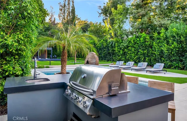 a living room with a fireplace and a flat screen tv