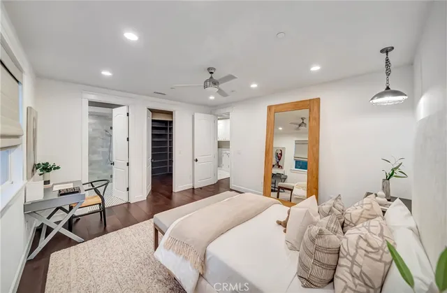 a bedroom with a bed and a couch