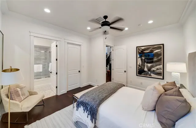 a bathroom with a granite countertop sink a toilet and shower