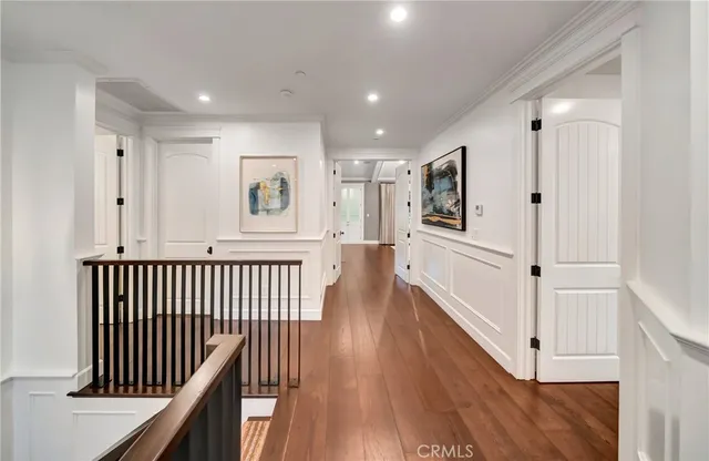 a living room with patio furniture and a potted plant