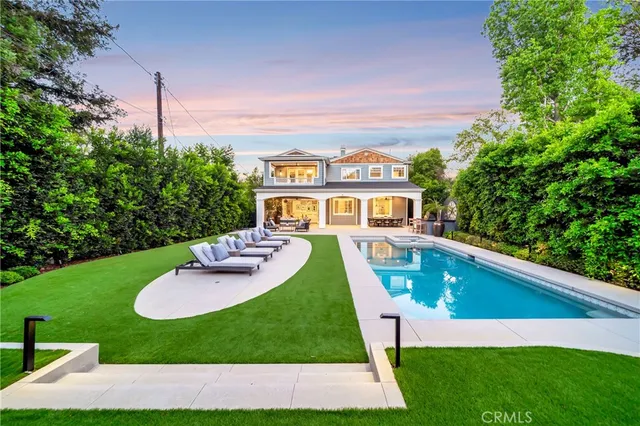 a large kitchen with a table and chairs in it