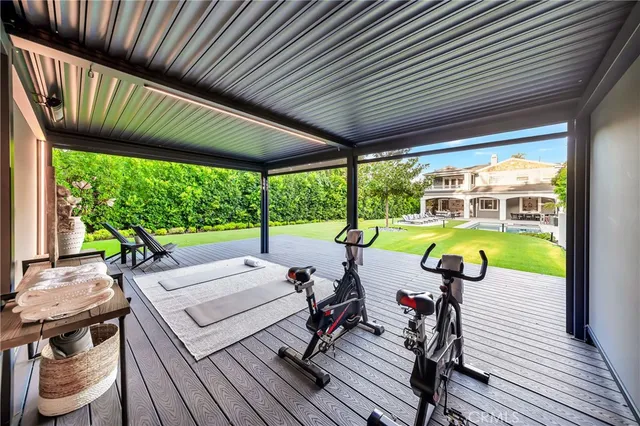 a view of balcony with wooden floor and outdoor seating