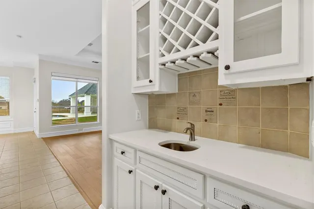 a kitchen with a sink and cabinets