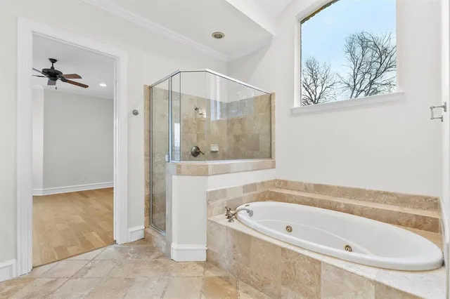 a bathroom with a tub and shower