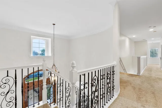 a view of a hallway with windows