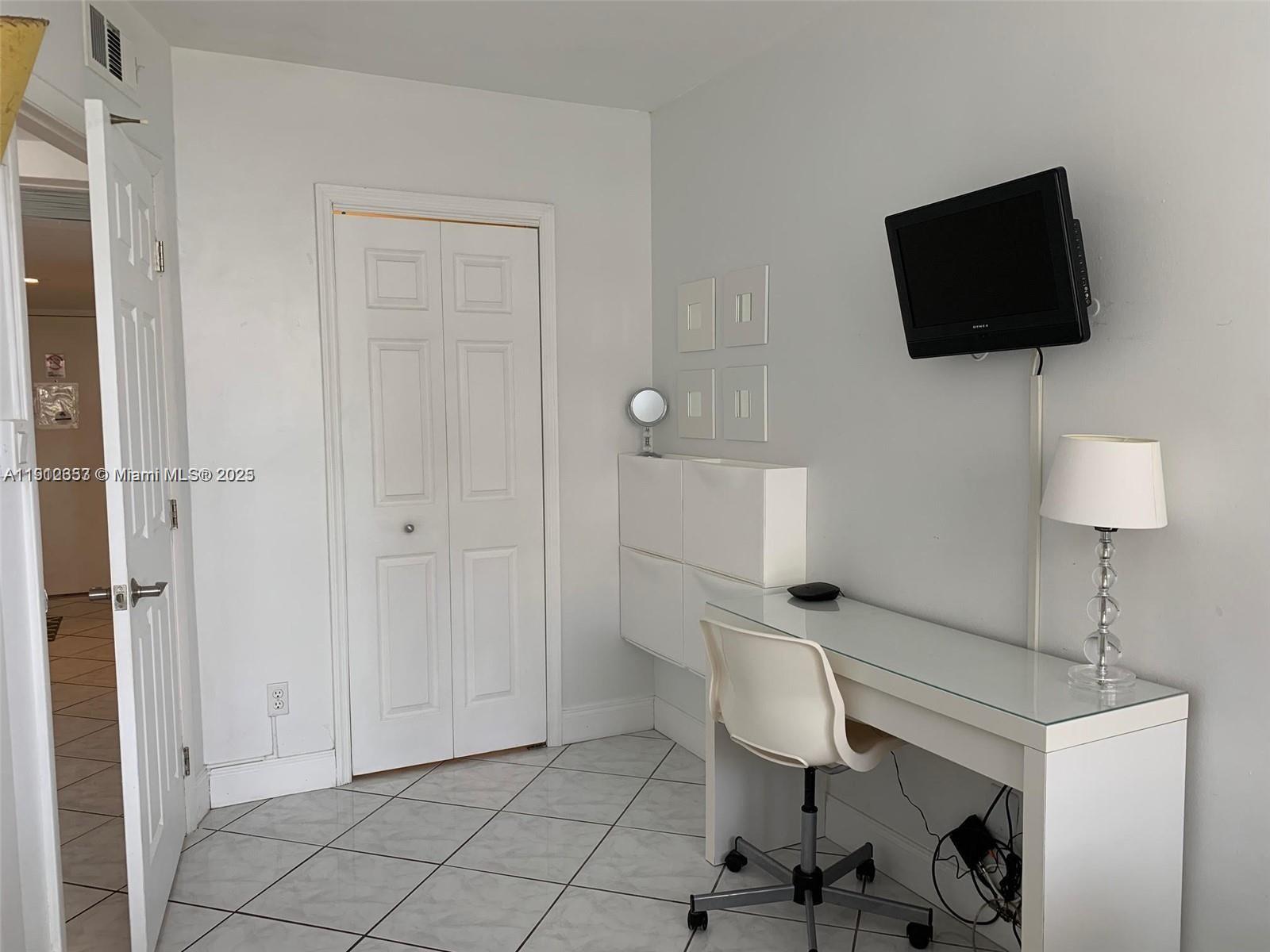 100 Lincoln Road, Unit 638 Miami Beach, FL 33139 - Photo 12 of 26 a view of a livingroom with furniture and a flat screen tv