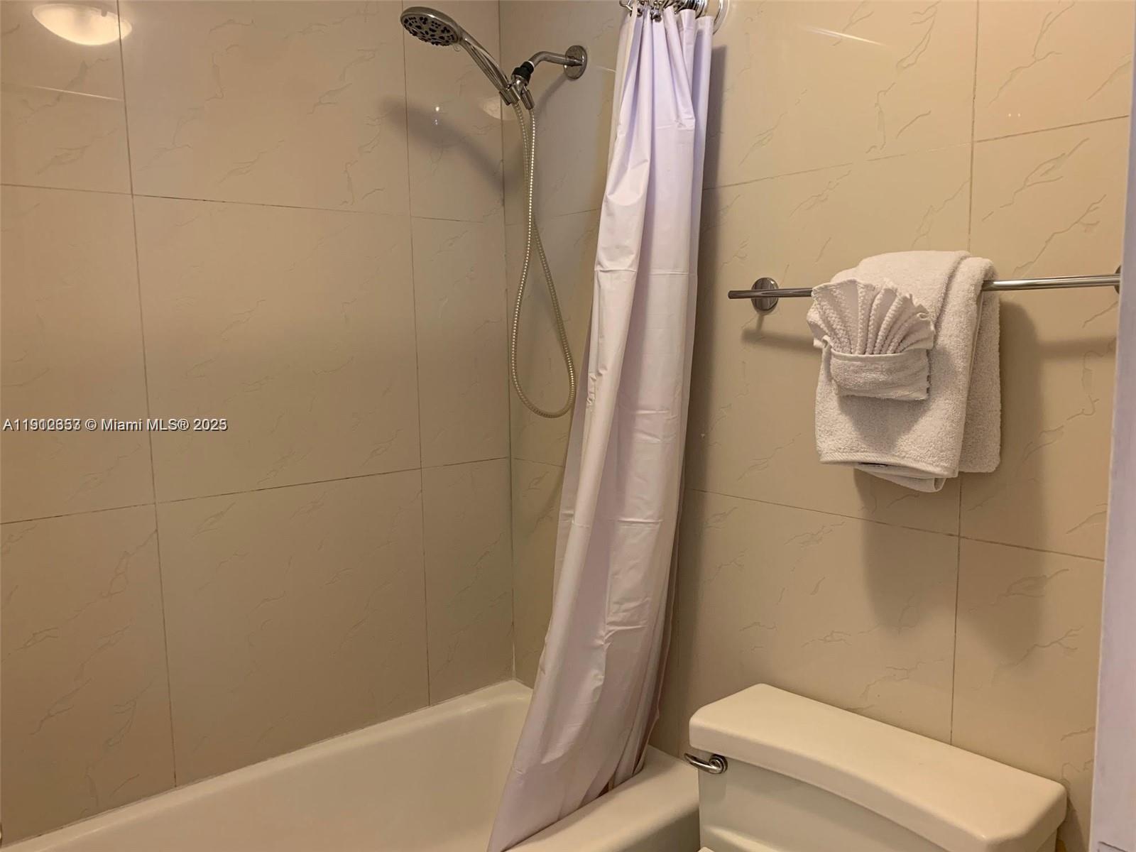 100 Lincoln Road, Unit 638 Miami Beach, FL 33139 - Photo 14 of 26 a bathroom with a shower and toilet