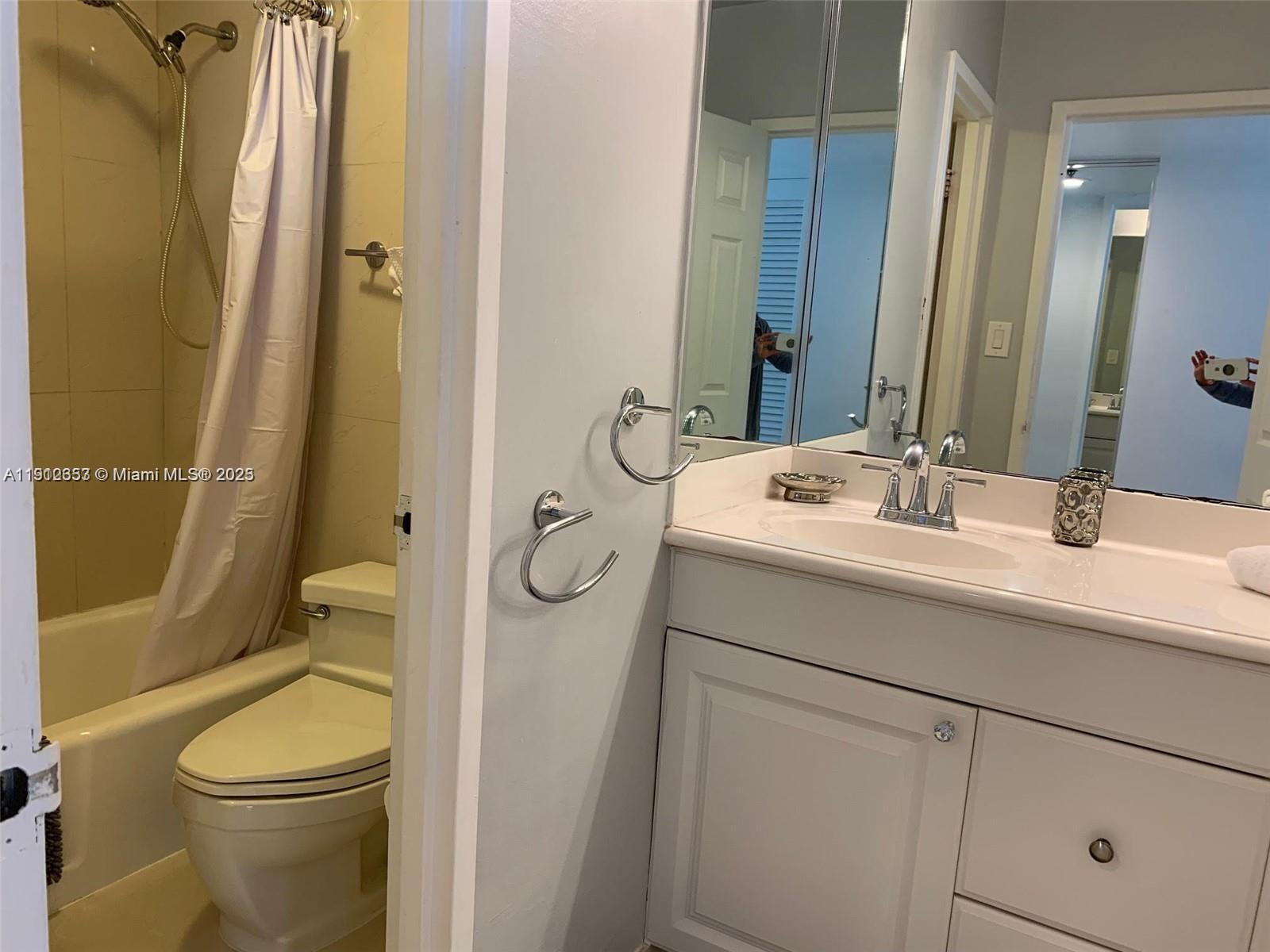 100 Lincoln Road, Unit 638 Miami Beach, FL 33139 - Photo 16 of 26 a bathroom with a sink a toilet and shower
