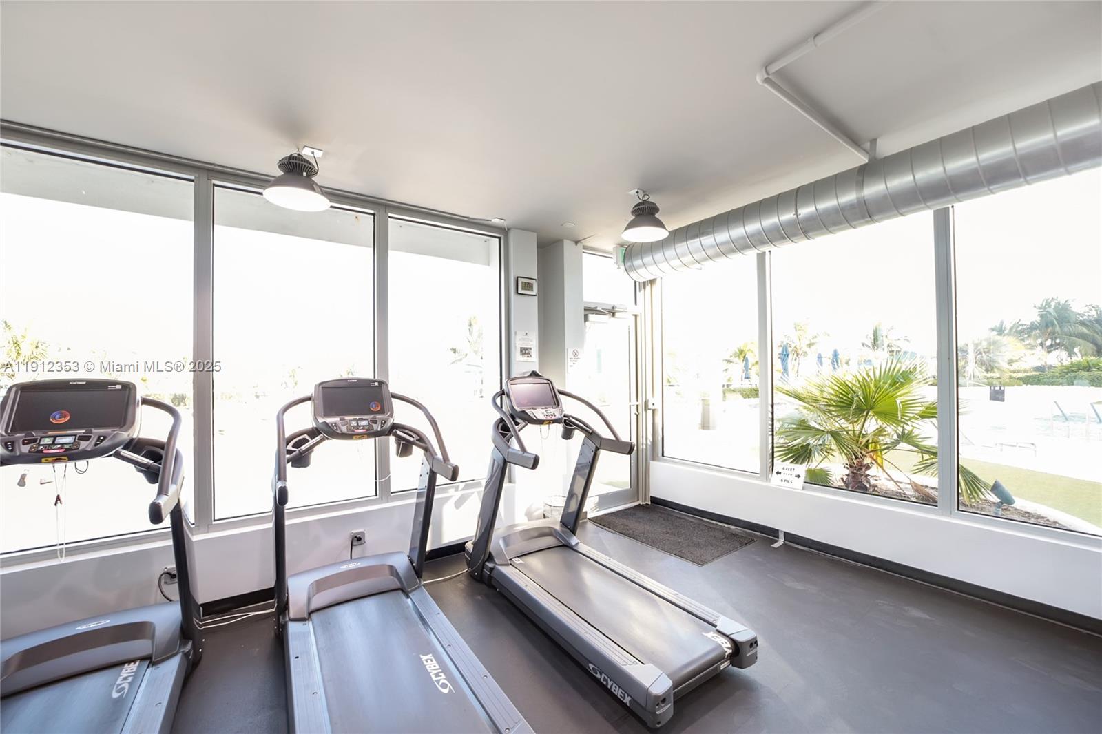 100 Lincoln Road, Unit 638 Miami Beach, FL 33139 - Photo 22 of 26 a view of a room with wooden floor and windows