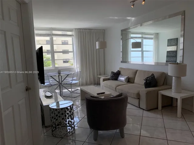 a living room with furniture and window