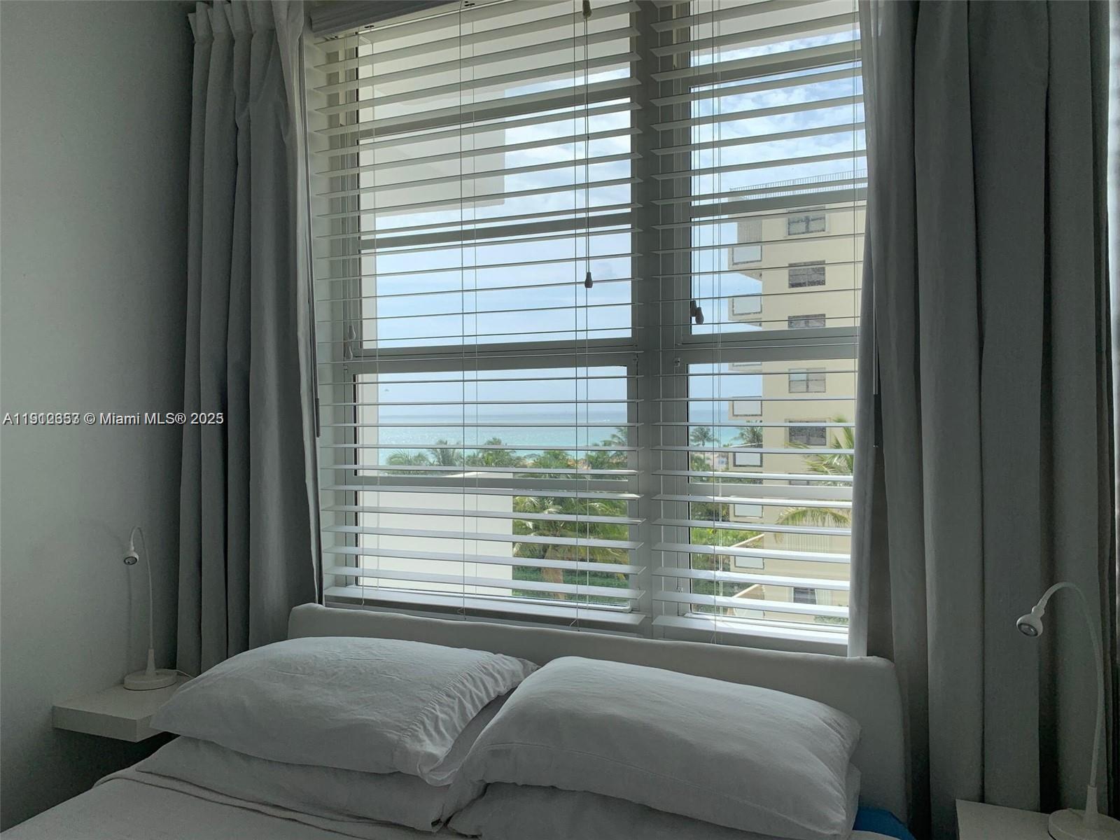 100 Lincoln Road, Unit 638 Miami Beach, FL 33139 - Photo 9 of 26 a bedroom with a bed and a window