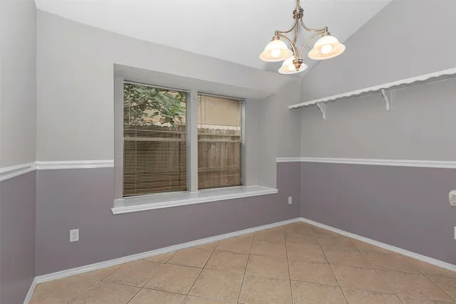 a view of kitchen with granite countertop cabinets and stainless steel appliances
