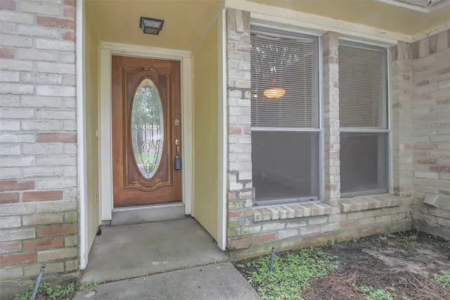 a view of hallway with wooden floor