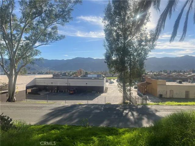 a view of a house with yard swimming pool and a yard