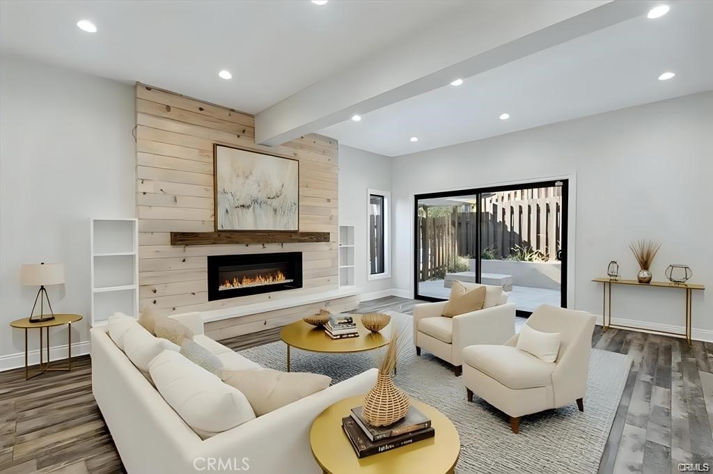 10831 Roycroft Street, Unit 72 Sun Valley, CA 91352 - Photo 13 of 33 a living room with furniture and a fireplace