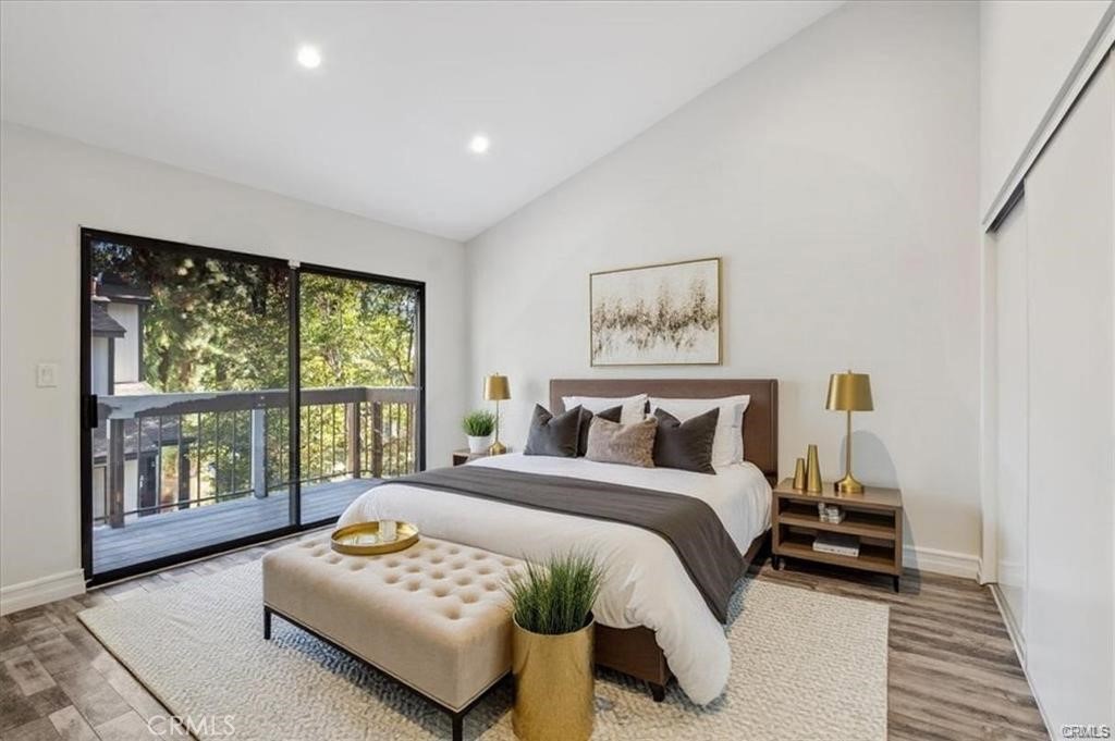 10831 Roycroft Street, Unit 72 Sun Valley, CA 91352 - Photo 17 of 33 a bedroom with a bed and a large window