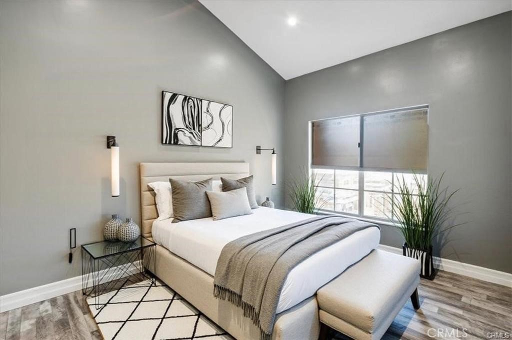 10831 Roycroft Street, Unit 72 Sun Valley, CA 91352 - Photo 25 of 33 a bedroom with a bed and a potted plant