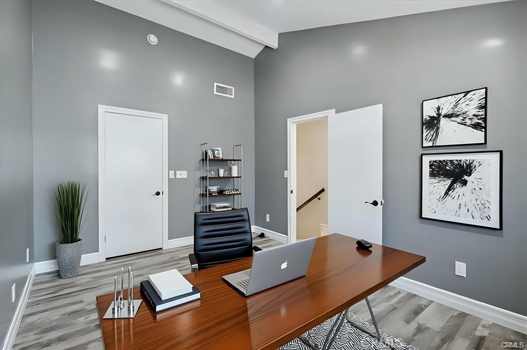 10831 Roycroft Street, Unit 72 Sun Valley, CA 91352 - Photo 27 of 33 a living room with furniture and wooden floor