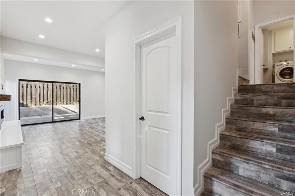 10831 Roycroft Street, Unit 72 Sun Valley, CA 91352 - Photo 6 of 33 a view of a hallway with wooden floor and entryway