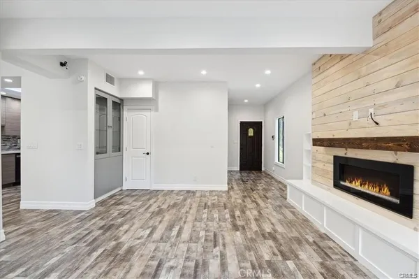 a view of an empty room and fire place